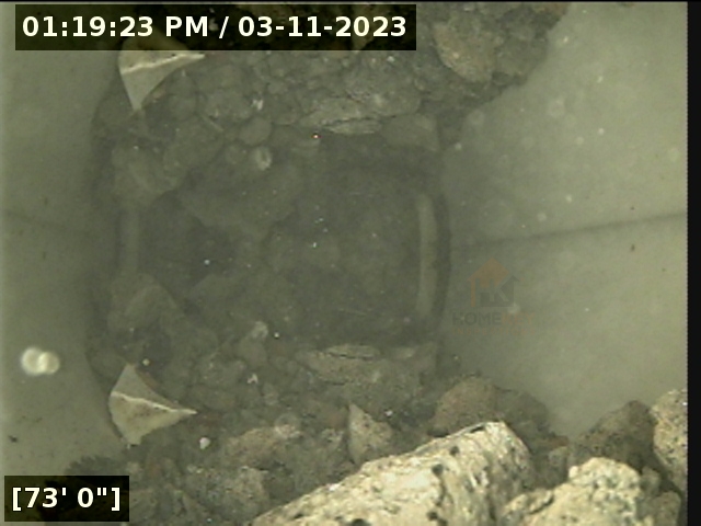 rocks and debris obstructing sewer lateral