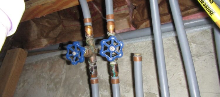 grey polybutylene piping in use